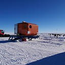 Sunny day at Oldest Ice Reconnaissance field camp in Dronning Maud Land. Drying laundry and sleeping cabin.